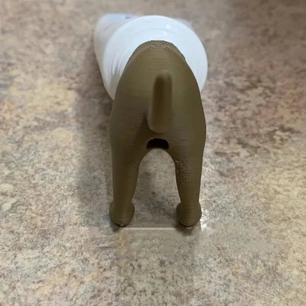 Porte-pâte à dents Chiot qui fait caca