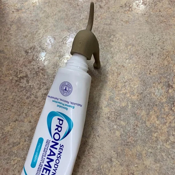Porte-pâte à dents Chiot qui fait caca