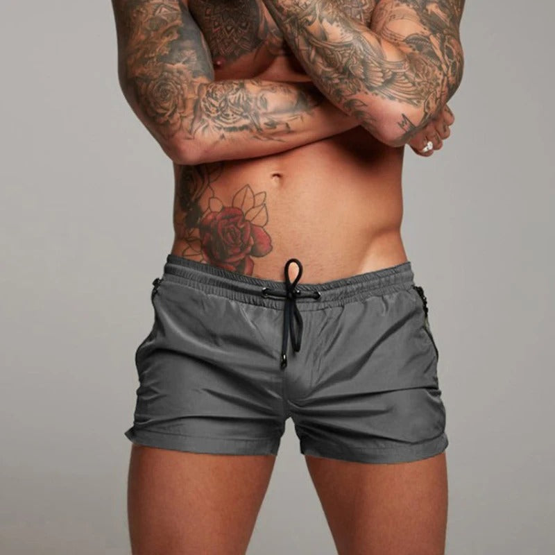 Shorts de bain pour hommes en tissu extensible et à séchage rapide avec poches
